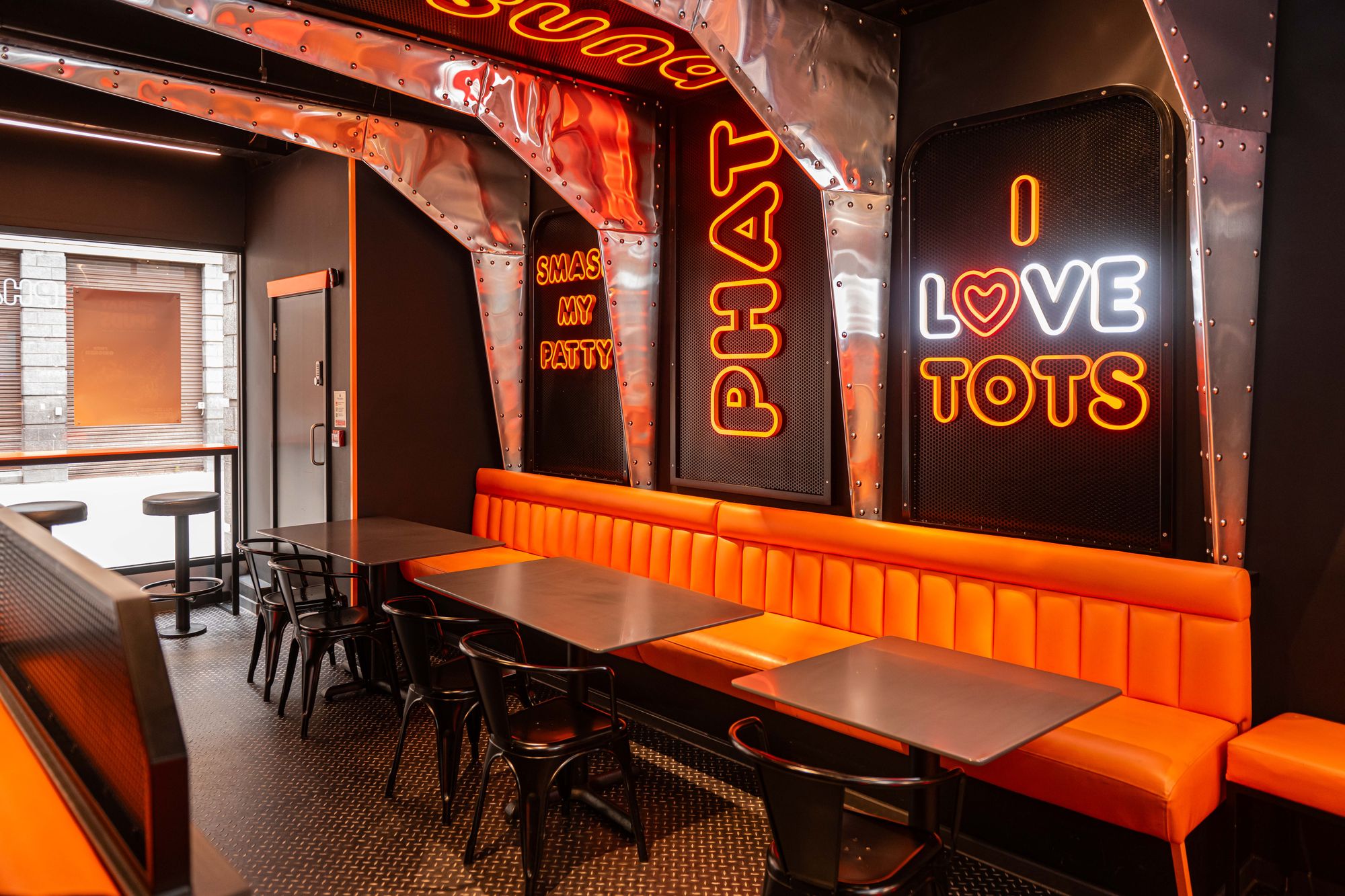 PHAT Buns interior with neon signage